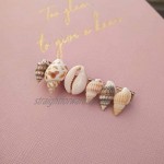 Hair accessory set of 2 hair clips in beach look with cowrie shells as a hair pin.